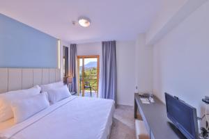 Postel nebo postele na pokoji v ubytování Hera Hotel
