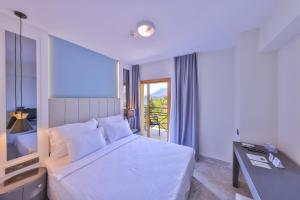 Postel nebo postele na pokoji v ubytování Hera Hotel
