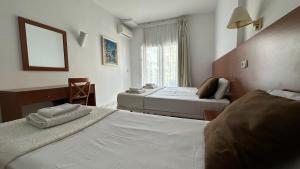 A bed or beds in a room at Hotel Sant March