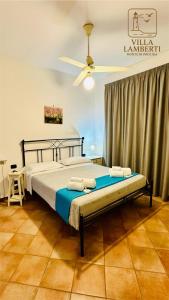 Ένα ή περισσότερα κρεβάτια σε δωμάτιο στο Villa Lamberti