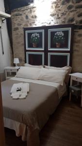 A bed or beds in a room at La Casetta nel Borgo