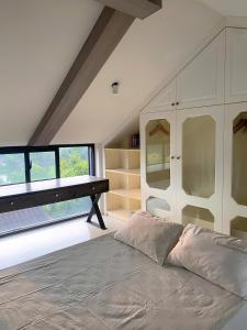 Postel nebo postele na pokoji v ubytování Nâu's house