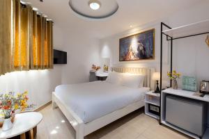 Postel nebo postele na pokoji v ubytování Alpina Regal Hotel