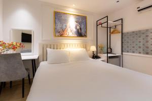 Postel nebo postele na pokoji v ubytování Alpina Regal Hotel