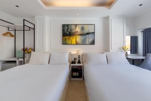 Postel nebo postele na pokoji v ubytování Alpina Regal Hotel