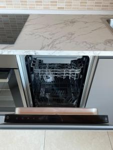 an oven with its door open in a kitchen at Apartment Murnera in Mozzate +16 photos