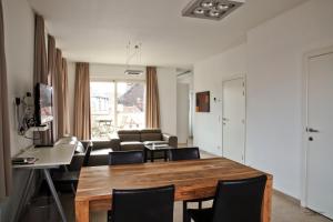 a living room filled with furniture and a table at Place 2 stay in Ghent