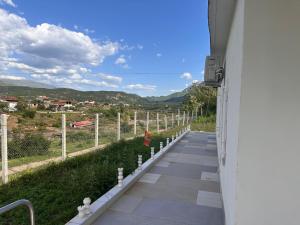 a walkway in a building with a view of a mountain at Calma rooms in Përmet