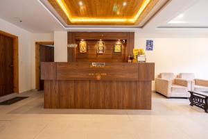 a lobby with a reception desk in a building at Himalayan Spurge Villa in Manāli