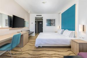 a hotel room with a bed and a tv at Park Plaza Histria Pula in Pula