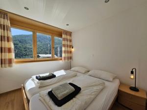 Postel nebo postele na pokoji v ubytování Aramis Lodge