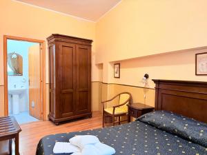 Letto o letti in una camera di Hotel Archimede Ortigia