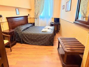 Letto o letti in una camera di Hotel Archimede Ortigia
