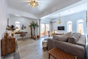 a living room with a couch and a table at DeCaNa Prestige Apartment - Gated Community Algarve in Porches