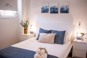 a bedroom with a bed with blue and white at Fuerte Luxury Penthouse & Jacuzzi in La Herradura