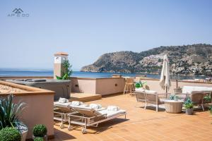 a patio with a view of the ocean at Fuerte Luxury Penthouse & Jacuzzi in La Herradura