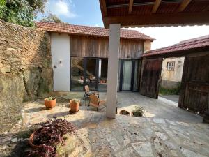 a patio of a house with a building at Casa Abílio - country house in Alvoeira +15 photos