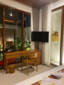 TV a/nebo společenská místnost v ubytování Dream House Ubud
