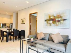 a living room with a couch and a table at Vortex KLCC by Family Suites in Kuala Lumpur