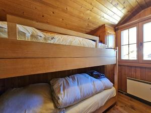 a bedroom with two bunk beds in a cabin at Chalet Le Camée in Saas-Fee +3 photos