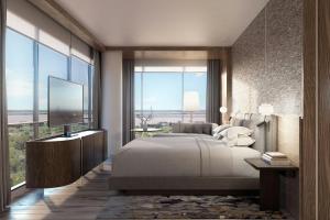 Postel nebo postele na pokoji v ubytování Marriott Corrientes