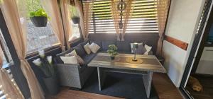 a small room with a table and a window at Mobile Home Sea Shell Šime, Drage in Drage