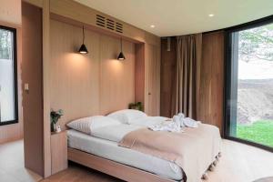 Voodi või voodid majutusasutuse LumiPod – Luxe glazen design‑pod toas