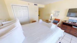 Voodi või voodid majutusasutuse Islander Beach Resort 302 toas