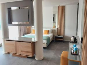 Posteľ alebo postele v izbe v ubytovaní HOTEL ASTOR