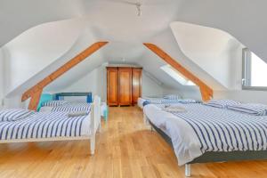 Ein Bett oder Betten in einem Zimmer der Unterkunft Villa Léa Vue mer d'exception Plage
