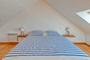 Ein Bett oder Betten in einem Zimmer der Unterkunft Villa Léa Vue mer d'exception Plage