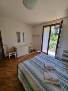 Postel nebo postele na pokoji v ubytování Casa ARIA Iseo Lake - panoramic house with private pool