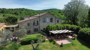 an aerial view of a stone house with a garden at Agriturismo Arlena in Bolsena