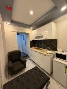 a kitchen with a chair and a table in it at BDK hotel in Istanbul