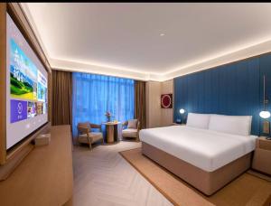 Jingdong Headquarters Crystal Orange Hotel, Yizhuang, Beijing房間的床
