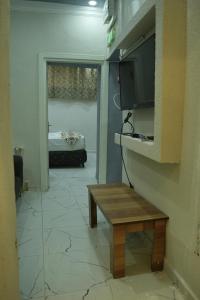 a living room with a table and a tv and a couch at BDK hotel in Istanbul +51 photos