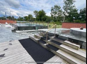 a skate park with stairs and a swimming pool at Stort Aktivitets-Feriehus Med Fri Badeland, Bowling, Badminton Og Tennis, in Henne