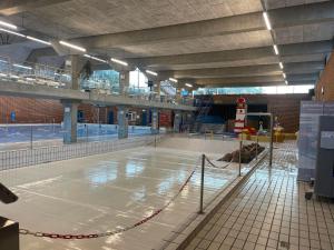 a large swimming pool in a large building at Stort Aktivitets-Feriehus Med Fri Badeland, Bowling, Badminton Og Tennis, in Henne +22 photos