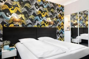 Postel nebo postele na pokoji v ubytování Liv'Inn Aparthotel