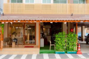a store front with plants in front of it at SNOW HOUSE Buriram in Buriram