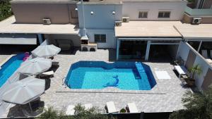 The swimming pool at or close to Villa Fantasia- Less than 5-Min Walk to Kalivaki Beach