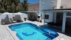 The swimming pool at or close to Villa Fantasia- Less than 5-Min Walk to Kalivaki Beach