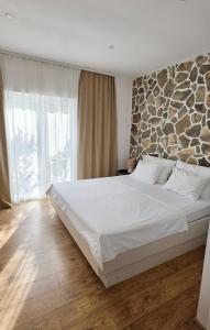 Letto o letti in una camera di Island Cottage Apartment
