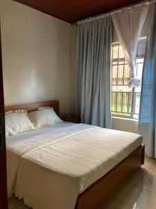 Katil atau katil-katil dalam bilik di Serene home in a quiet area +7 gambar