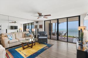 a living room with a couch and a table at Beach Club Siesta #104 in Key West