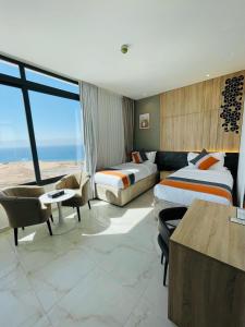 Postel nebo postele na pokoji v ubytování Diamond Palm Hotel & Resort + 37 fotografií