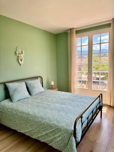 Postel nebo postele na pokoji v ubytování Le Cocon de La Bastide