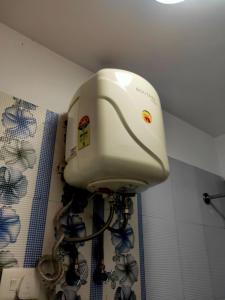 a blow dryer in the corner of a bathroom at Bon The Rink Heritage in Darjeeling