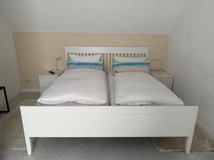 Postel nebo postele na pokoji v ubytování Ostseewellen