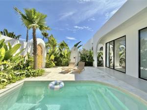 a swimming pool with a ball in a house at Dolce One-Bedroom Villas in Uluwatu +15 photos